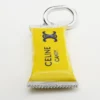 Charms Candy Bar in Enamel and Brass with Rhodium Finish Charms Candy Bar in Enamel and Brass with Rhodium Finish