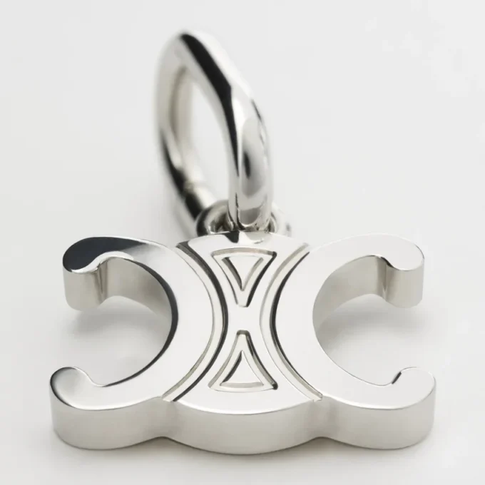 Charms Triomphe in Brass with Rhodium Finish Charms Triomphe in Brass with Rhodium Finish