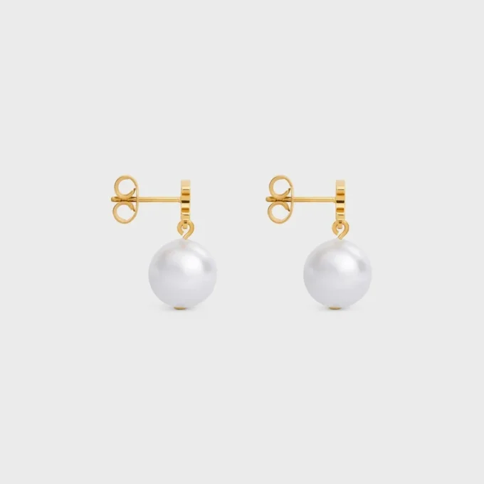Les Perles Celine Earrings in Brass with Gold Finish and Resin Pearls Les Perles Celine Earrings in Brass with Gold Finish and Resin Pearls