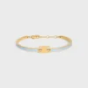 Triomphe Articulated Bracelet in Enamel and Brass with Gold Finish Triomphe Articulated Bracelet in Enamel and Brass with Gold Finish