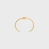 Triomphe Asymmetric Cuff in Brass with Gold Finish Triomphe Asymmetric Cuff in Brass with Gold Finish