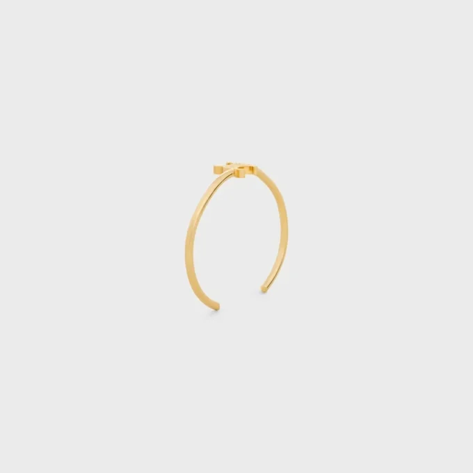 Triomphe Asymmetric Cuff in Brass with Gold Finish Triomphe Asymmetric Cuff in Brass with Gold Finish