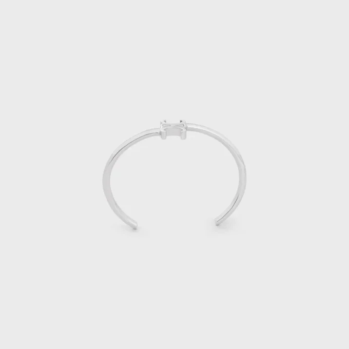 Triomphe Asymmetric Cuff in Brass with Rhodium Finish Triomphe Asymmetric Cuff in Brass with Rhodium Finish