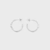 Triomphe Asymmetric Hoops in Brass with Rhodium Finish Triomphe Asymmetric Hoops in Brass with Rhodium Finish