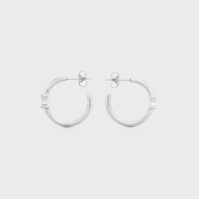 Triomphe Asymmetric Hoops in Brass with Rhodium Finish Triomphe Asymmetric Hoops in Brass with Rhodium Finish