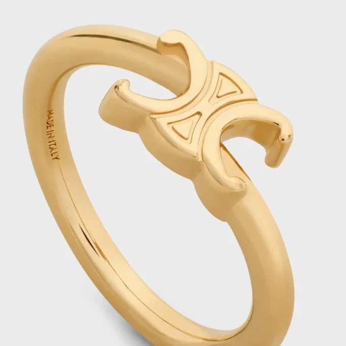 Triomphe Asymmetric Ring in Brass with Gold Finish Triomphe Asymmetric Ring in Brass with Gold Finish