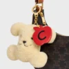 Triomphe Pom-Pom Charm Apple in Shearling and Calfskin Triomphe Pom-Pom Charm Apple in Shearling and Calfskin
